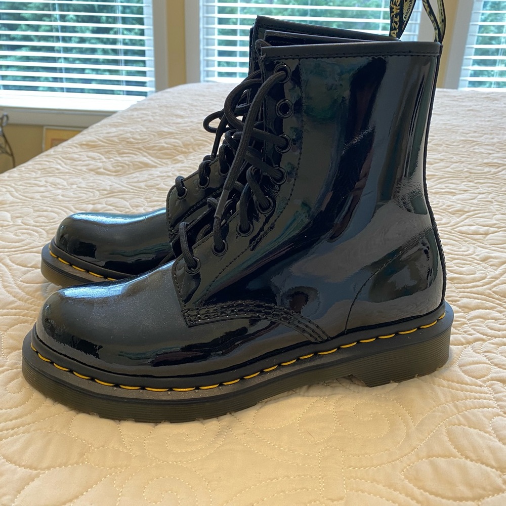 Dr. Martens 1460 black patent leather combat boots.